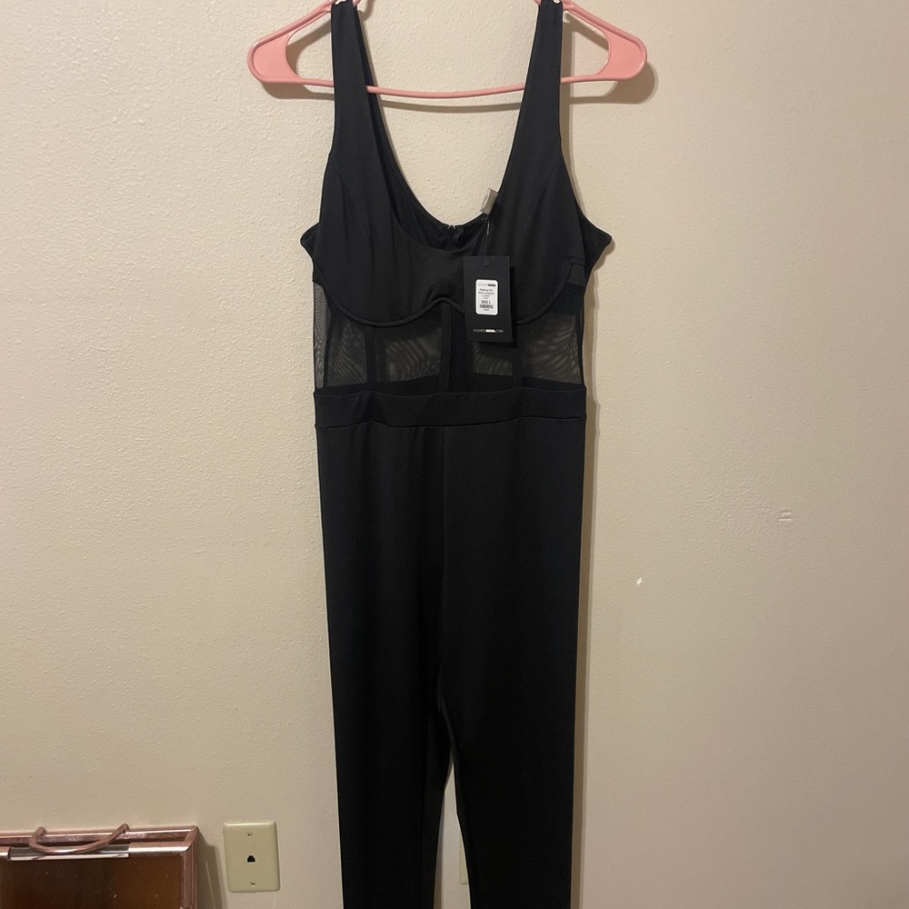 Black body suit with mesh underneath the boob area